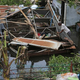 Farmer Victor Lozada searches Friday for items that can be salvage from his shed in Puerto Rico that was completely destroyed by Hurricane Maria. (Carl Juste/Miami Herald)
